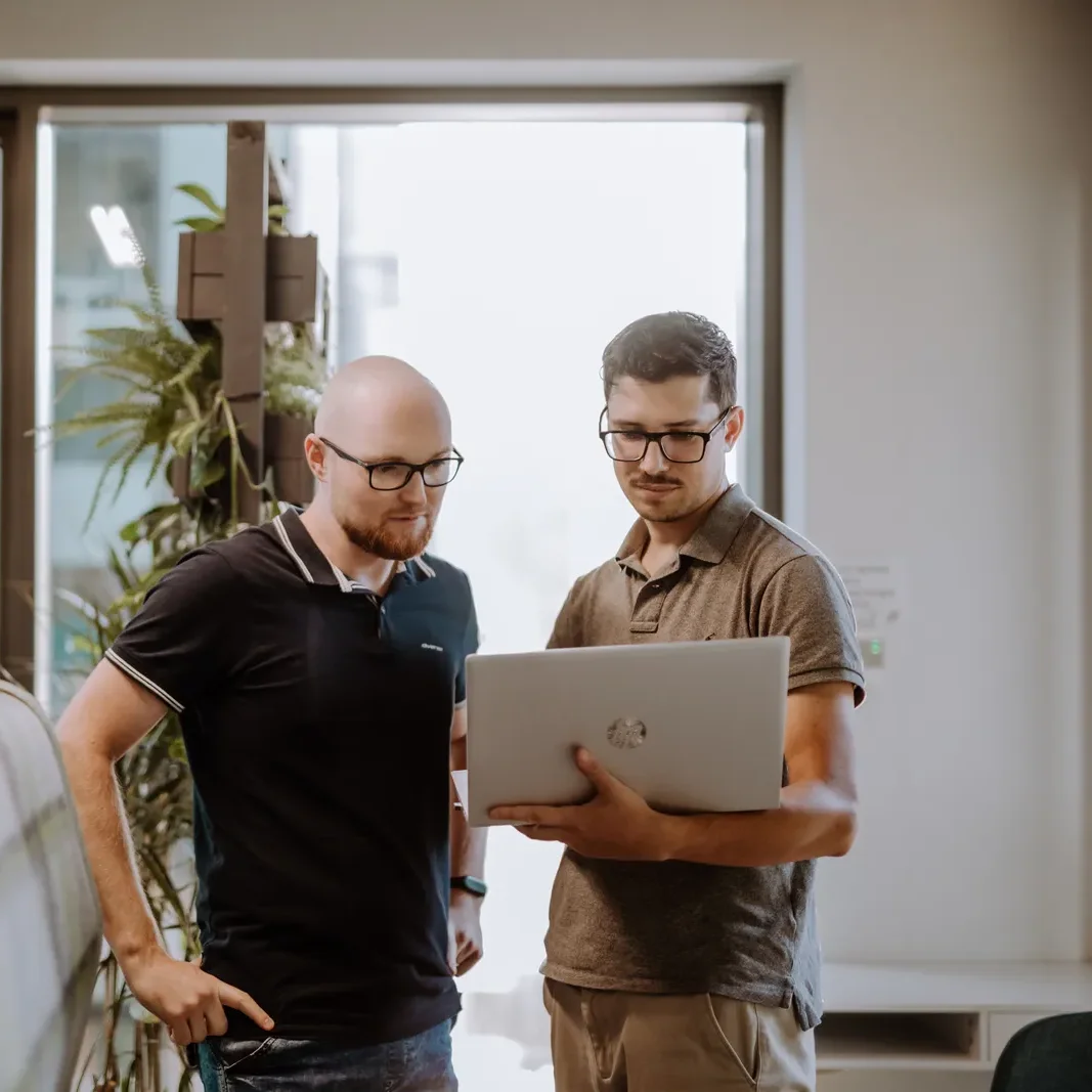 Two Xelerit engineers collaborating